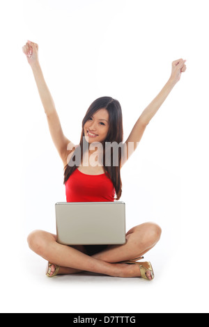 Happy asian female student sitting on lawn, with laptop, beautiful ...