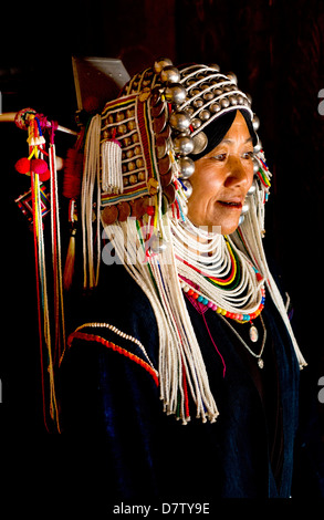 Woman of the Akha tribe in traditional dress, in a hill village near Kengtung (Kyaingtong), Shan State, Burma Stock Photo