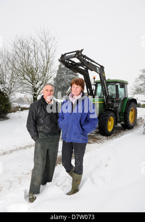 Dairy Farmers Chris & Liz Best from Poole Farm Leighterton near Tetbury, Gloucestershire who have had to discard milk when the t Stock Photo