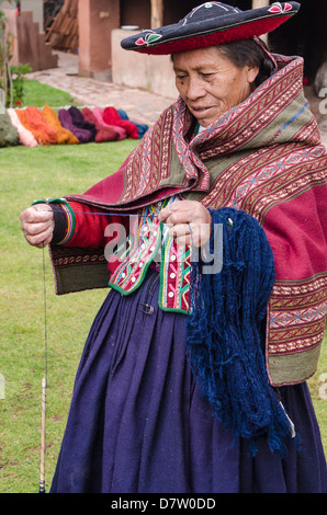 Inca woman spins yarn in Chinchero, Peru, South America Stock Photo