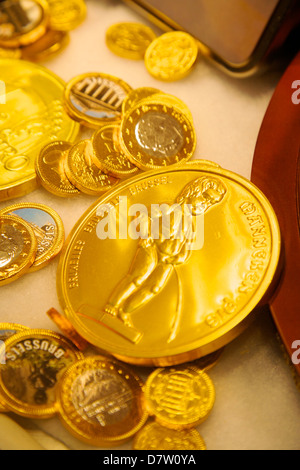 Manneken Pis coin in a sweet shop, Brussels, Belgium Stock Photo