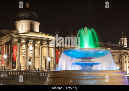 The National Gallery and fountain in Trafalgar Square at night, London, England, United Kingdom