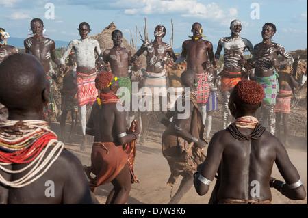 Karo people with body paintings participating in a tribal dance ceremony, Omo River Valley, Southern Ethiopia Stock Photo