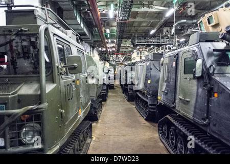 The Vehicle Deck onboard Assault Ship HMS Bulwark with Viking and BV personnel carrier vehicles of the Royal marines. Stock Photo