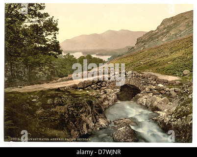 This image shows a scenic view of Derwentwater, Ashness Bridge, and Skiddaw in the Lake District, England. The photograph captures the natural beauty of the region, with its iconic bridge and lake views. Stock Photo