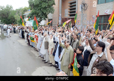 Supporters of Hazara Democratic Party (HDP) chant slogans against alleged rigging in general elections during protest demonstration at Quetta press club on Tuesday, May 14, 2013. Stock Photo