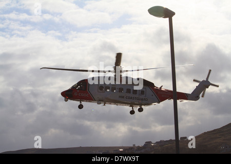 A coastguard helicopter coming in to land at Clickimin Leisure Centre, Lerwick, Shetland Islands Stock Photo