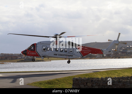 A coastguard helicopter coming in to land at Clickimin Leisure Centre, Lerwick, Shetland Islands Stock Photo