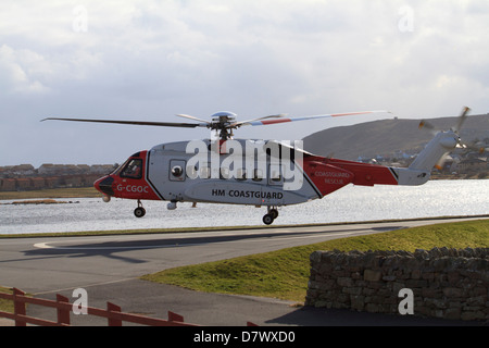 A coastguard helicopter coming in to land at Clickimin Leisure Centre, Lerwick, Shetland Islands Stock Photo