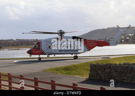 A coastguard helicopter coming in to land at Clickimin Leisure Centre, Lerwick, Shetland Islands Stock Photo