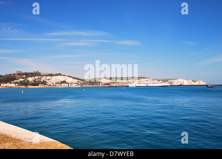 A view of the White Cliffs of Dover, Dover Castle and the port of Dover from  the end of the Prince of Wales pier in Dover. Stock Photo
