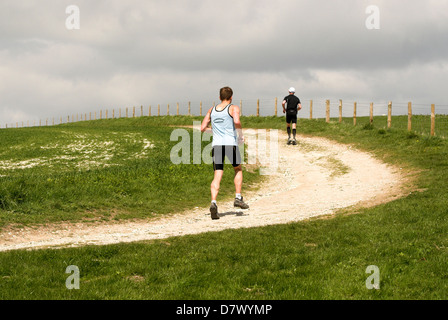 Runners on the Three Forts Challenge on their way to Chanctonbury Ring in West Sussex. Stock Photo
