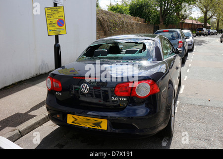 Rear windscreen of car smashed up, window broken into by thieves, robbery, vandalism Stock Photo