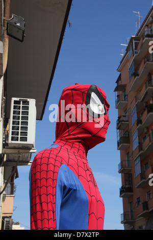 School Lab Mask A person wearing a Spider-Man mask participates in a high school ...