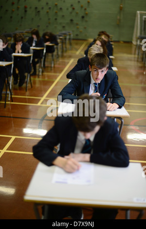 Secondary school pupils sat in a hall in exam conditions GCSE Stock Photo