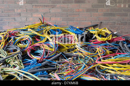 Pile of outer cables stripped of copper metals dumped in countryside Stock Photo