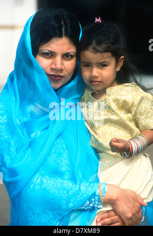 Sikh mother & daughter outside gurdwara (temple), Hounslow, Middlesex, UK. Stock Photo