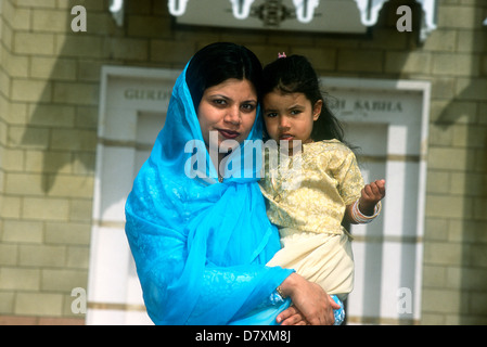 Sikh mother & daughter outside gurdwara (temple), Hounslow, Middlesex, UK. Stock Photo