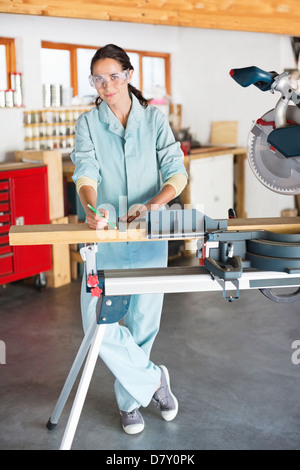Woman working in workshop Stock Photo