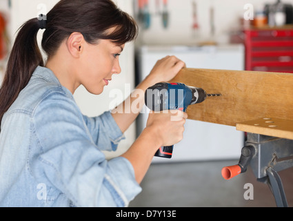 Woman working in workshop Stock Photo