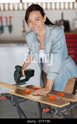 Woman working in workshop Stock Photo