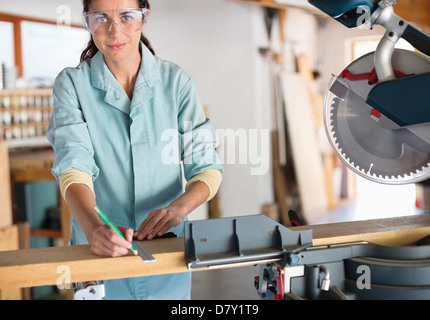 Woman working in workshop Stock Photo