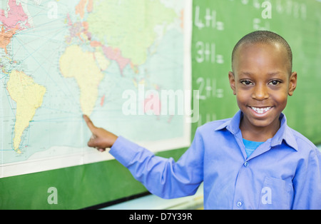 Student using world map in class Stock Photo