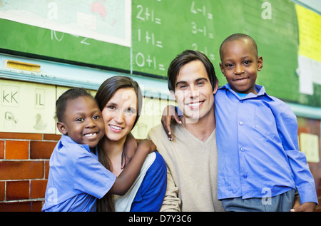 Teachers and students smiling in class Stock Photo