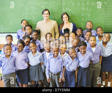 Students and teachers smiling in class Stock Photo