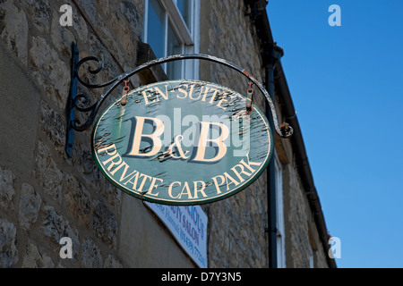 Close up of an old B & B B&B bed and breakfast hanging sign signs exterior with private car park England UK United Kingdom GB Great Britain Stock Photo