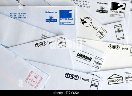 Close up of TNT UKMAIL Onepost used opened UK mail franked envelopes envelope letter letters post postal service England United Kingdom Great Britain Stock Photo