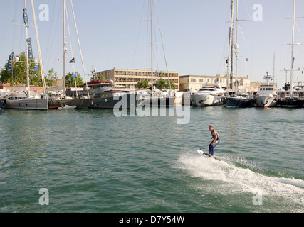 Palma International Boat Show 2013 - cabaret time courtesy of Lindsay McQueen demonstrating a powered surfboard - Old Port. Stock Photo