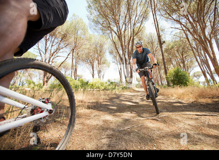 mountain bikers on dirt path Stock Photo