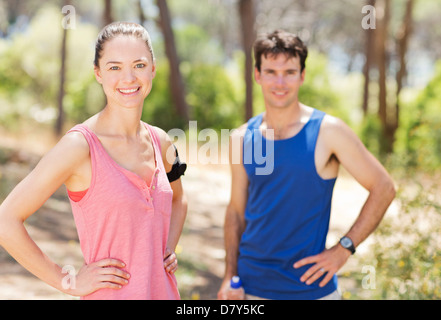 Couple resting during workout outdoors Stock Photo