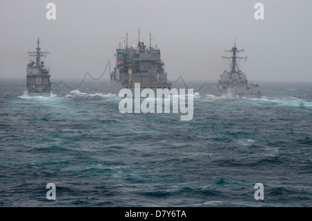 Ships conduct replenishment-at-sea. Stock Photo