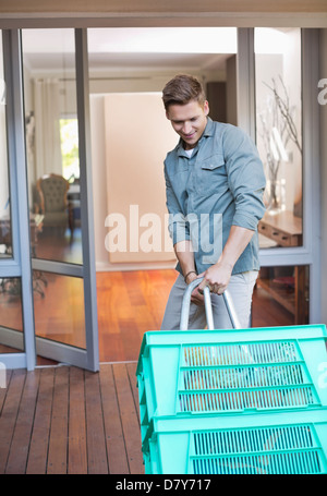 Man making deliveries on front porch Stock Photo