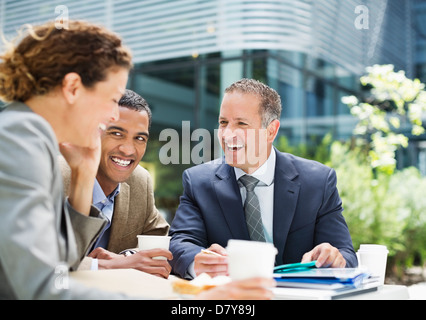 Business people talking outdoors Stock Photo