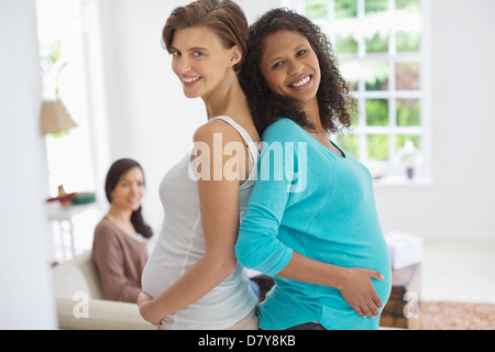 Pregnant women smiling together Stock Photo