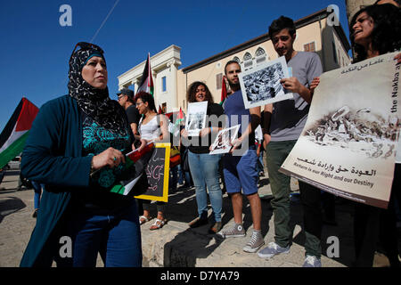 Israeli Arabs taking part in a rally in the old city of Jaffa Israel in honor of Nakba Day which is an annual day of commemoration of the displacement that preceded and followed the Israeli Declaration of Independence in 1948 Stock Photo