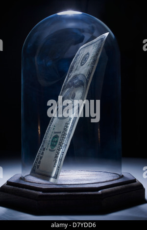 Dollar bill in bell jar Stock Photo