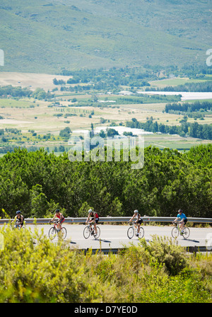 Cyclists in race on rural road Stock Photo