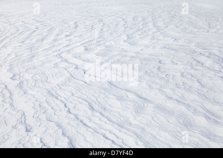 Background texture of snowdrift with nice curved shadows Stock Photo