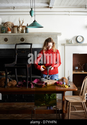 Woman cutting upholstery webbing Stock Photo