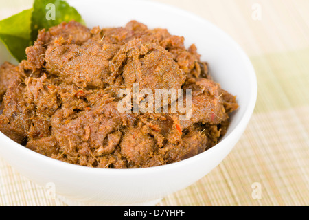 Rendang Daging - Dried beef curry with coconut milk and spices. Traditional Indonesia, Malaysian and Singaporean dish. Stock Photo