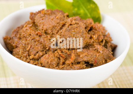 Rendang Daging - Dried beef curry with coconut milk and spices. Traditional Indonesia, Malaysian and Singaporean dish. Stock Photo