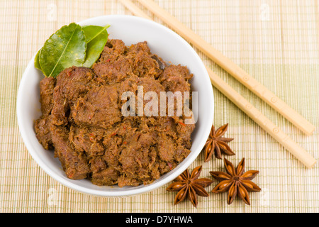 Rendang Daging - Dried beef curry with coconut milk and spices. Traditional Indonesia, Malaysian and Singaporean dish. Stock Photo