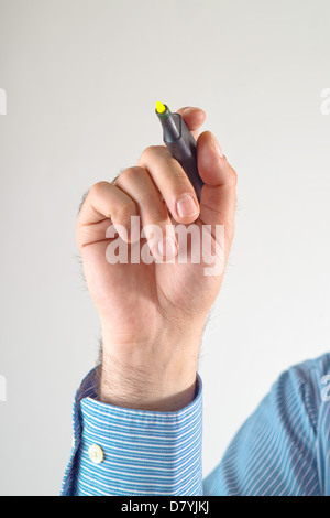 Businessman hand writing with yellow marker pen on the screen Stock Photo