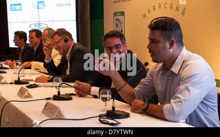 Ronaldo(foreground) cracks a joke during a FIFA press conference with FIFA´s General Secretary Jerome Valcke(third person along), while discussing progress on the Maracana Football Stadium, and the completion of construction work in time for the Confederations Cup Football tournament, where England play Brazil on the 2nd of June,2013, and the World Cup in 2014. Maracana Stadium, Rio de Janeiro, Brazil 15/05/2013 Stock Photo