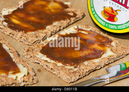 Ryvita rye crispbread with butter and Marmite yeast extract. UK, 2013. Stock Photo