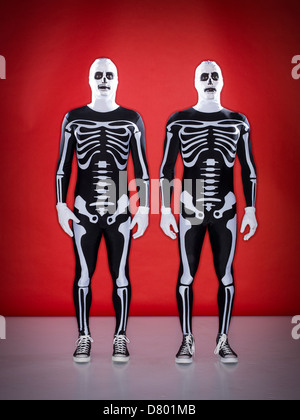 Caucasian men wearing skeleton costumes Stock Photo